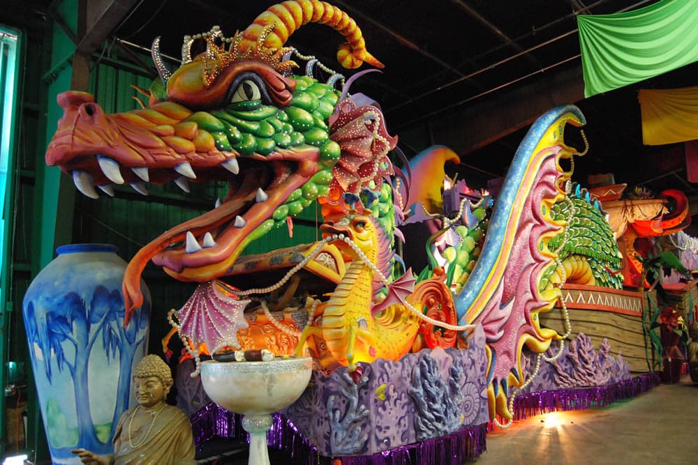 A vibrant, ornate dragon-themed float decorated with colorful details and embellishments.