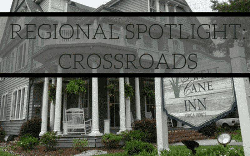 A historic inn with a porch and welcoming garden. A historic inn with a porch and welcoming garden.