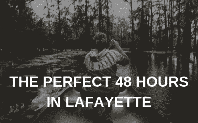 A person paddling a canoe in a serene bayou setting with the text "The Perfect 48 Hours in Lafayette." A person paddling a canoe in a serene bayou setting with the text "The Perfect 48 Hours in Lafayette."