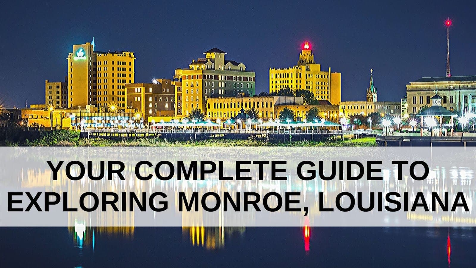City skyline of Monroe, Louisiana, illuminated at night with a text overlay for a guide to exploring the area. City skyline of Monroe, Louisiana, illuminated at night with a text overlay for a guide to exploring the area.