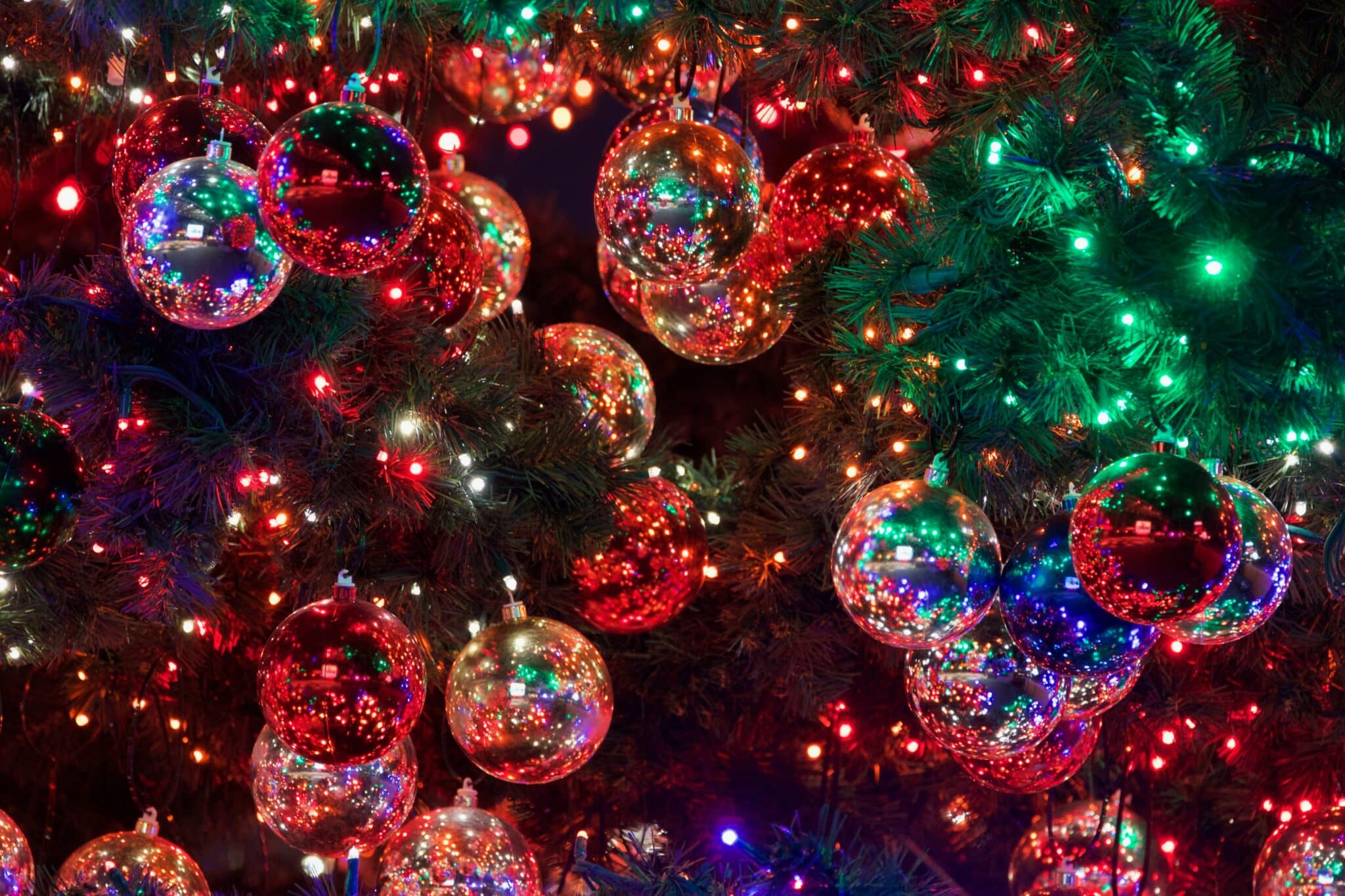 Lights and Christmas ornaments on a black background